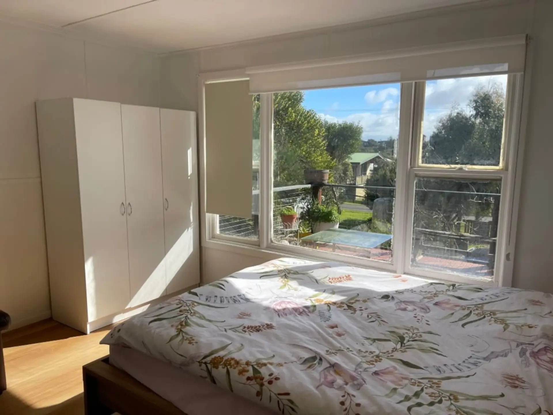 Cosy Tin Shack master bedroom with garden view