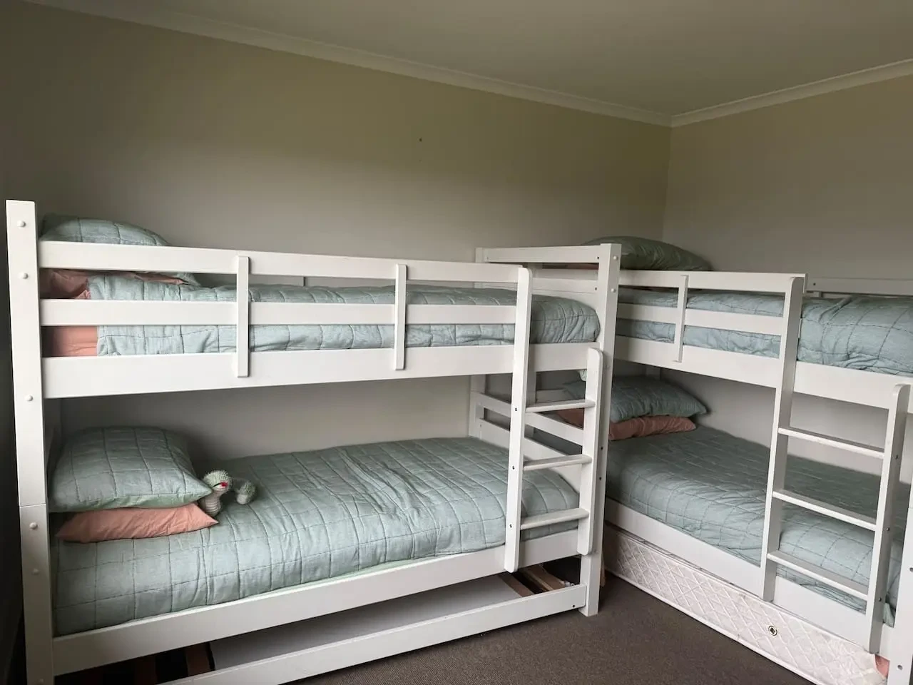 Lancaster Lodge bunk room with two sets of white bunk beds