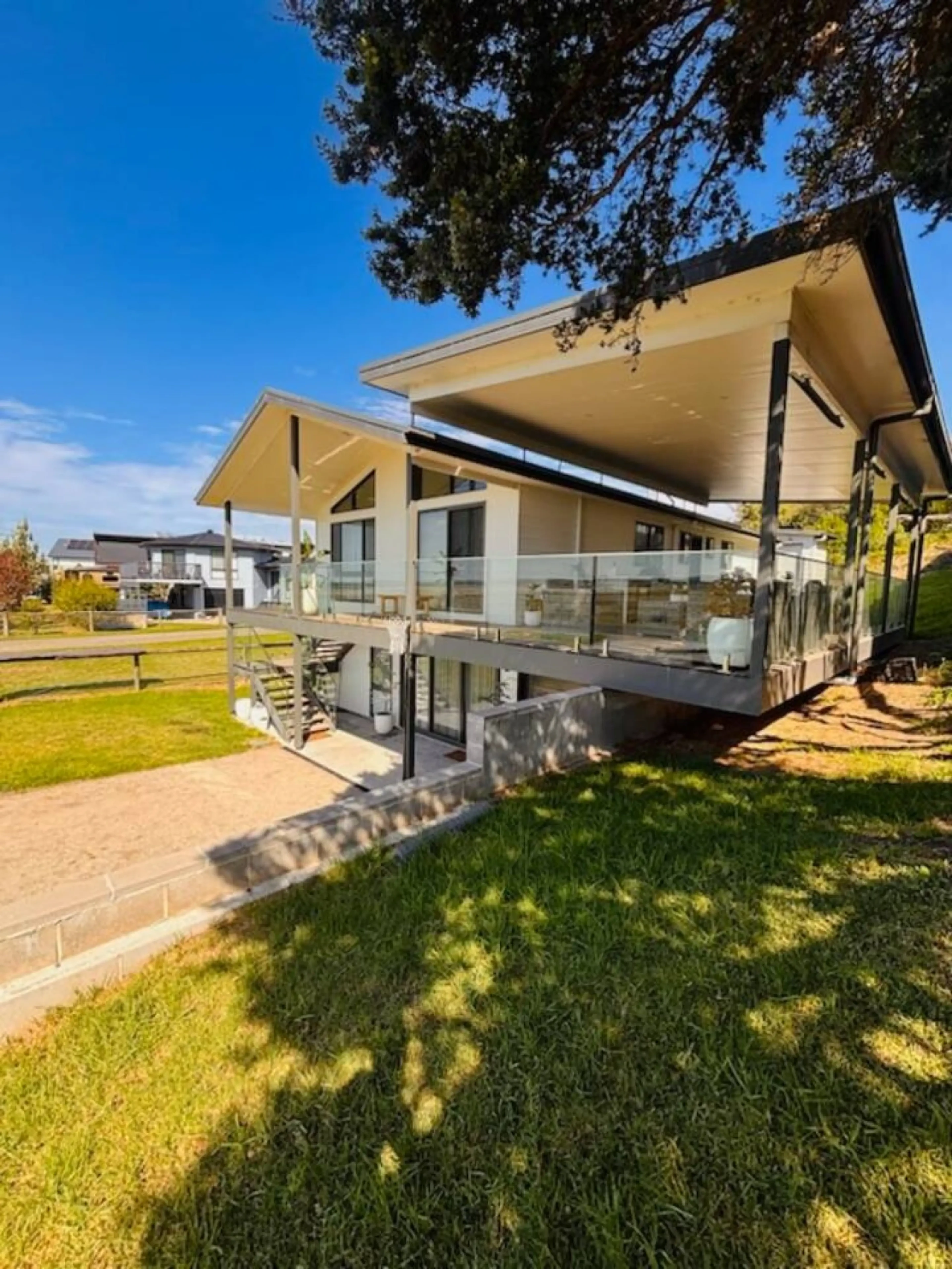 Lancaster Lodge exterior with elevated deck and glass railings