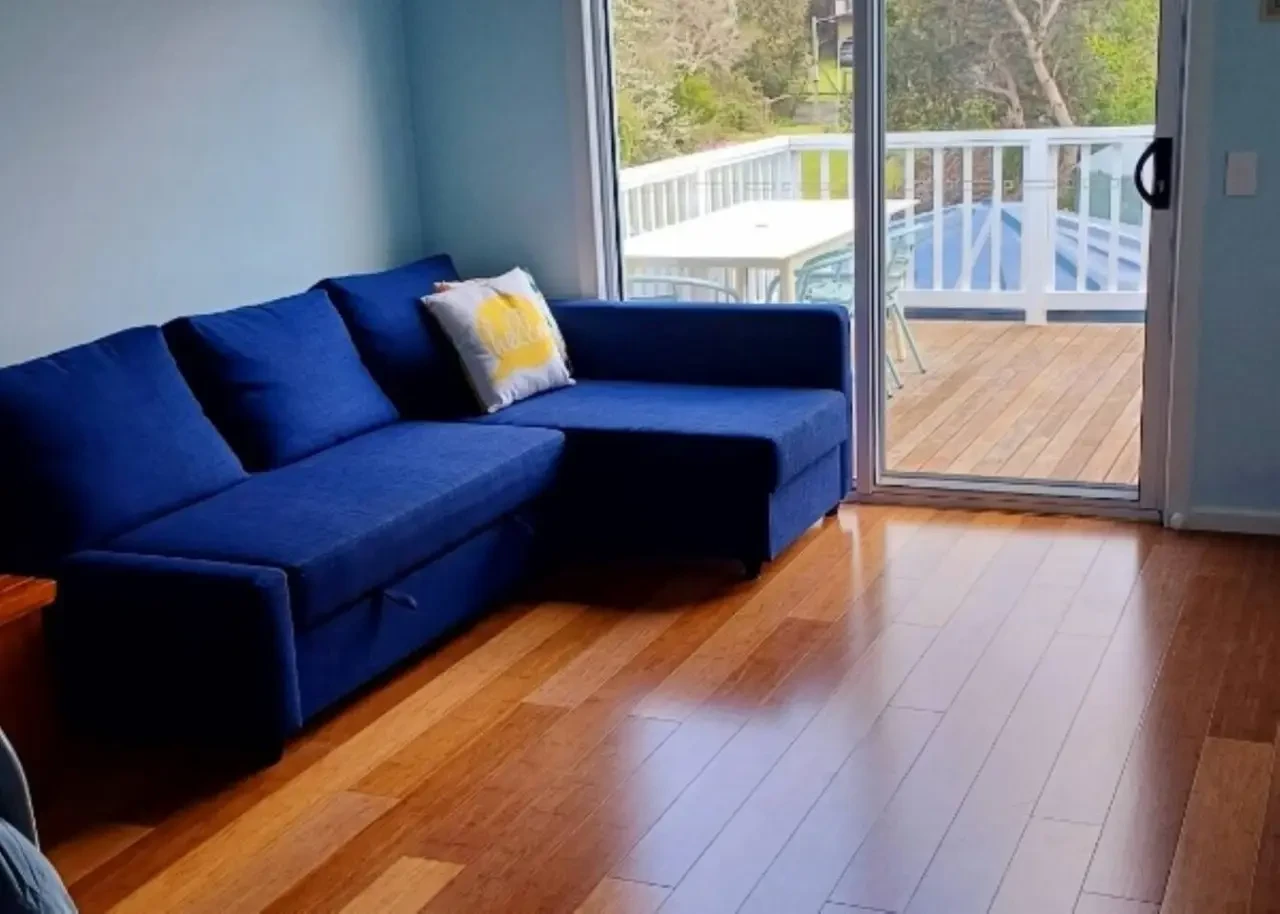 Ocean Blue — blue sectional sofa with deck view