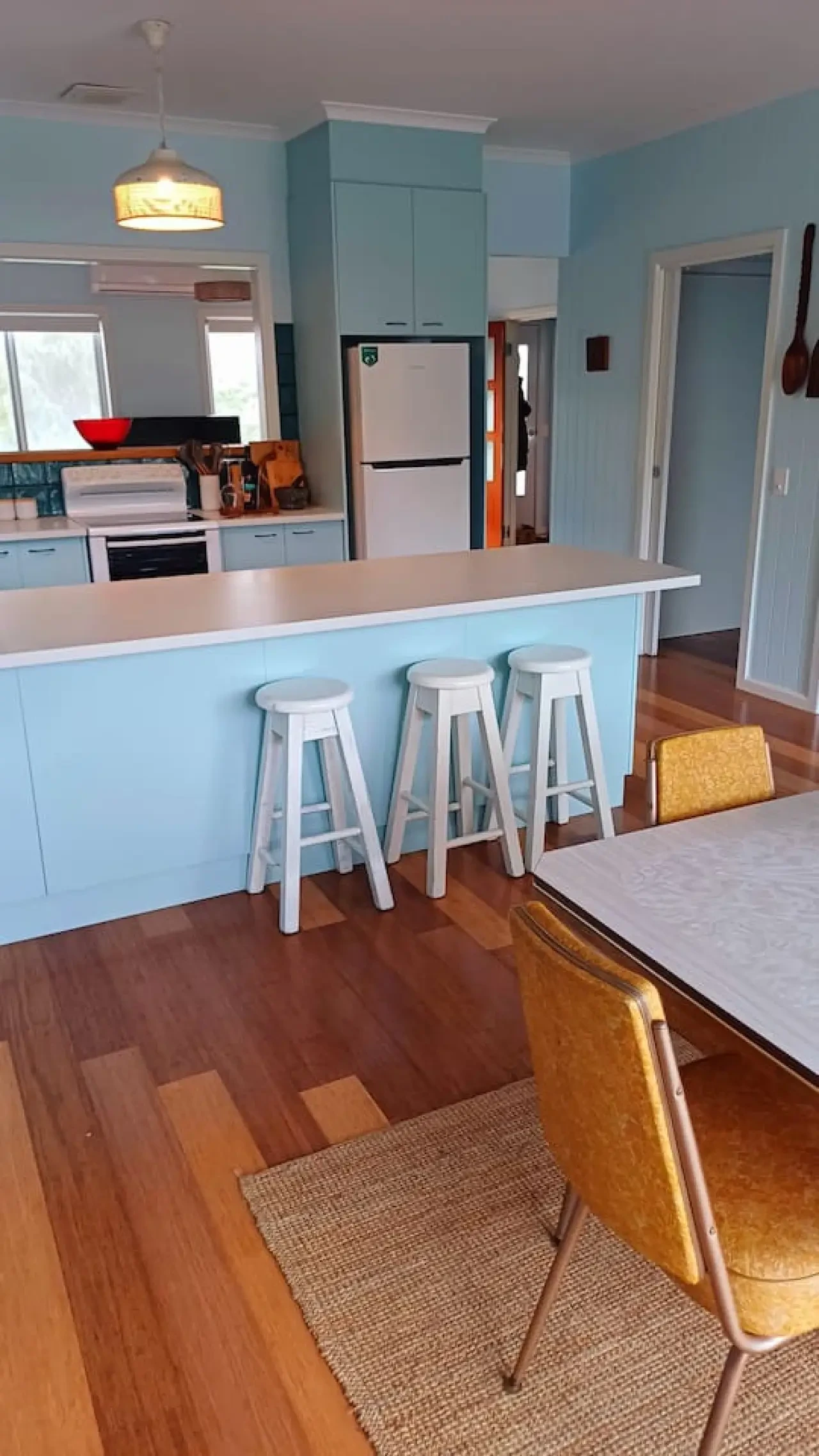 Ocean Blue — retro blue kitchen with island and bar stools
