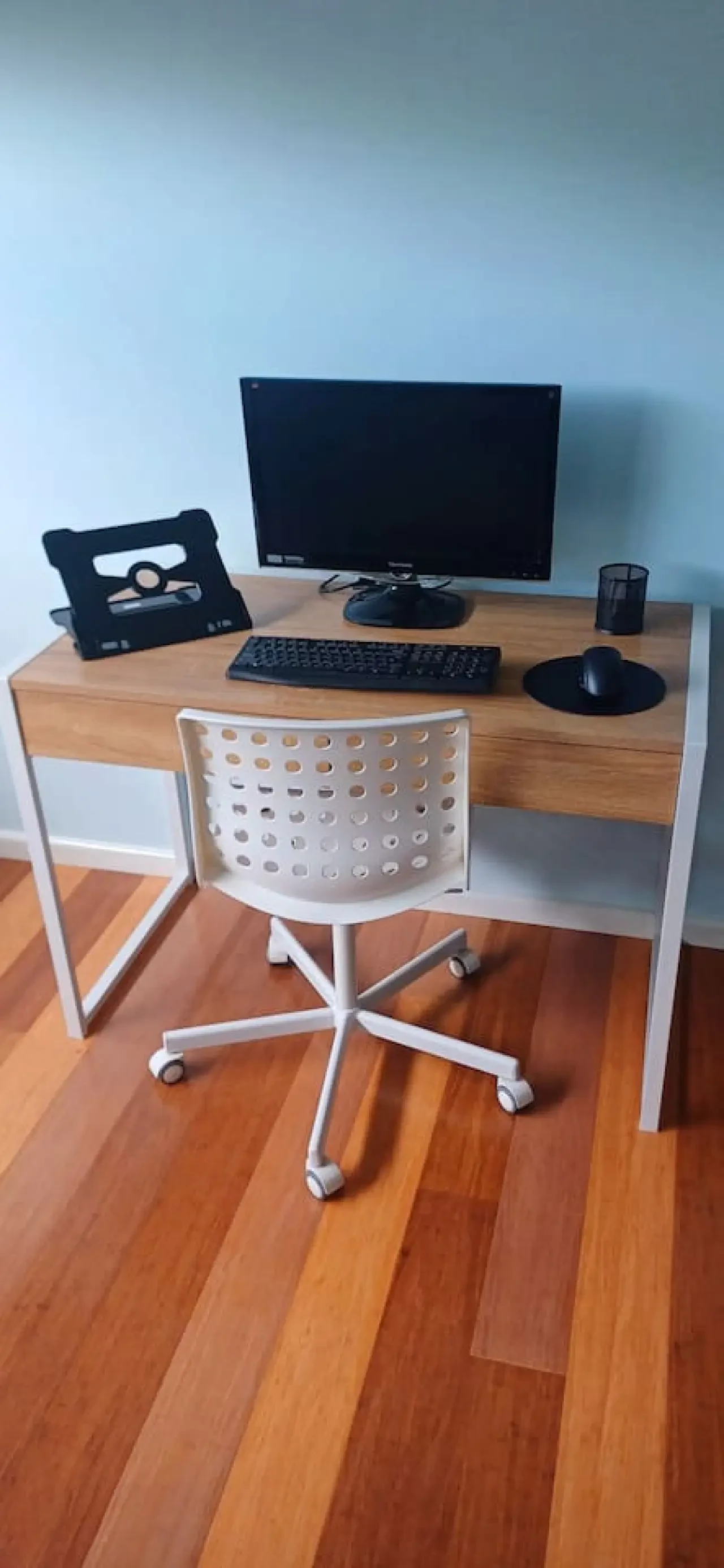 Ocean Blue — home office desk with monitor and timber floors
