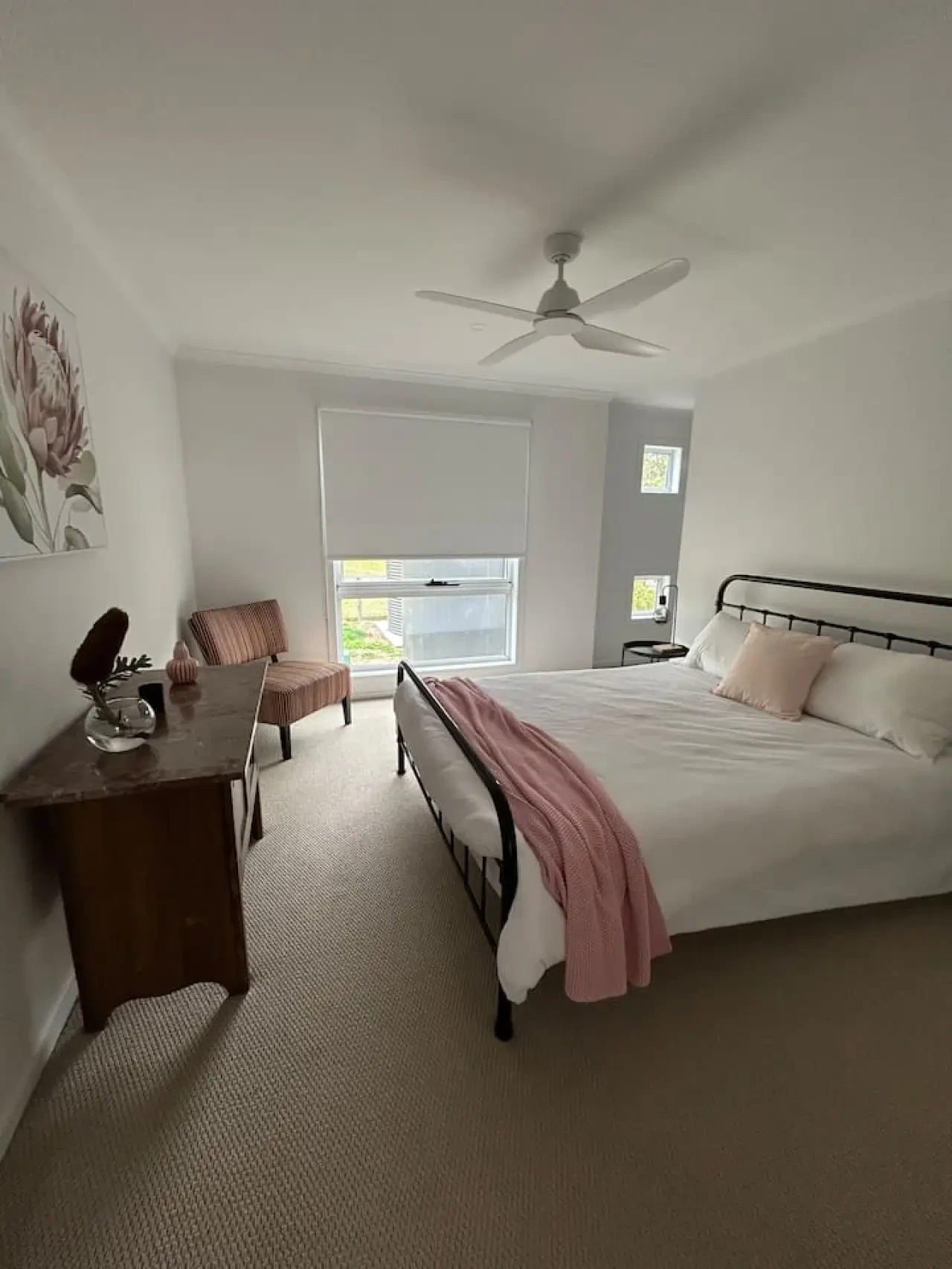 Roo Views master bedroom with queen bed and ceiling fan