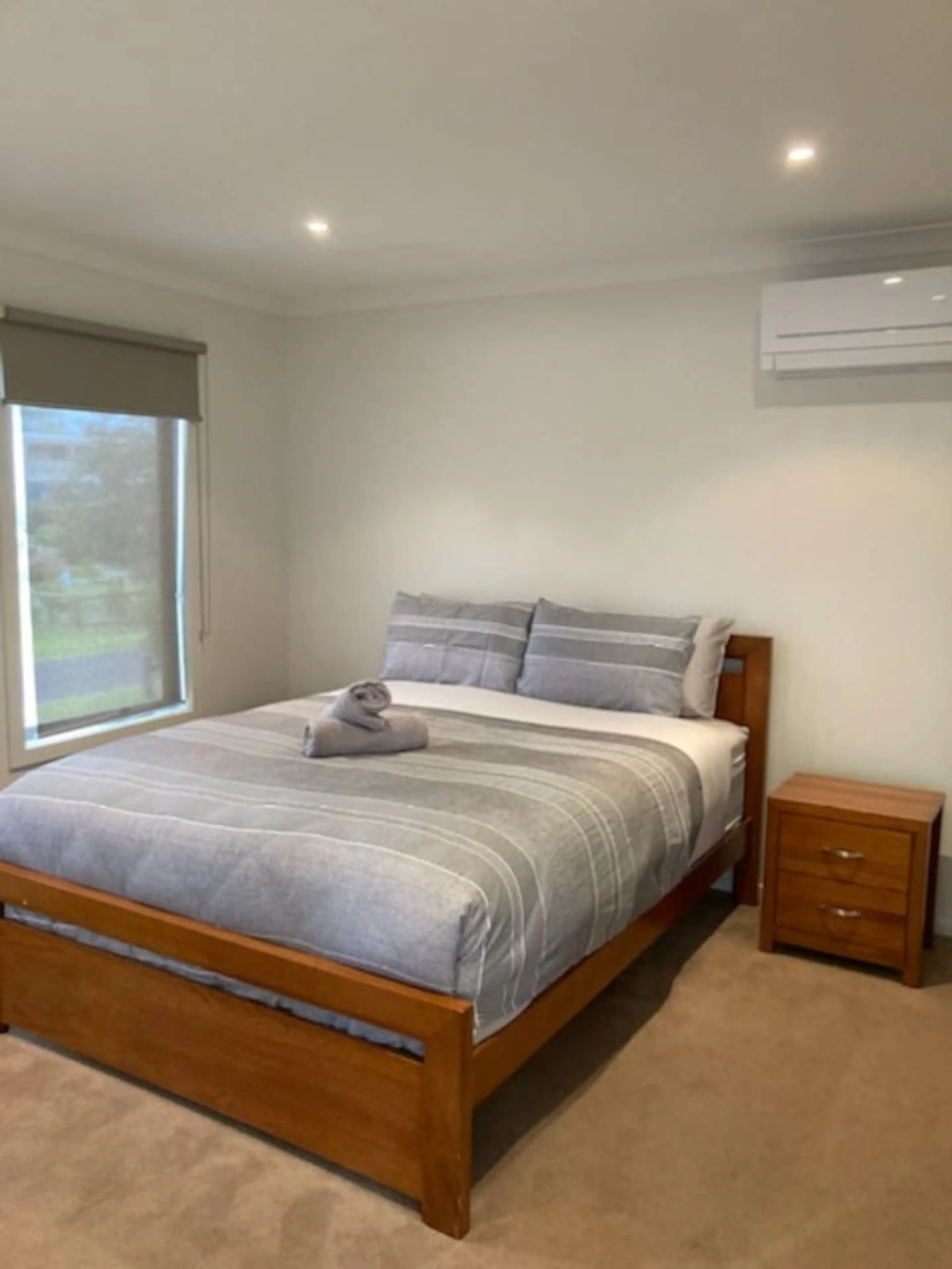 Venus Haven master bedroom with queen bed and air conditioning