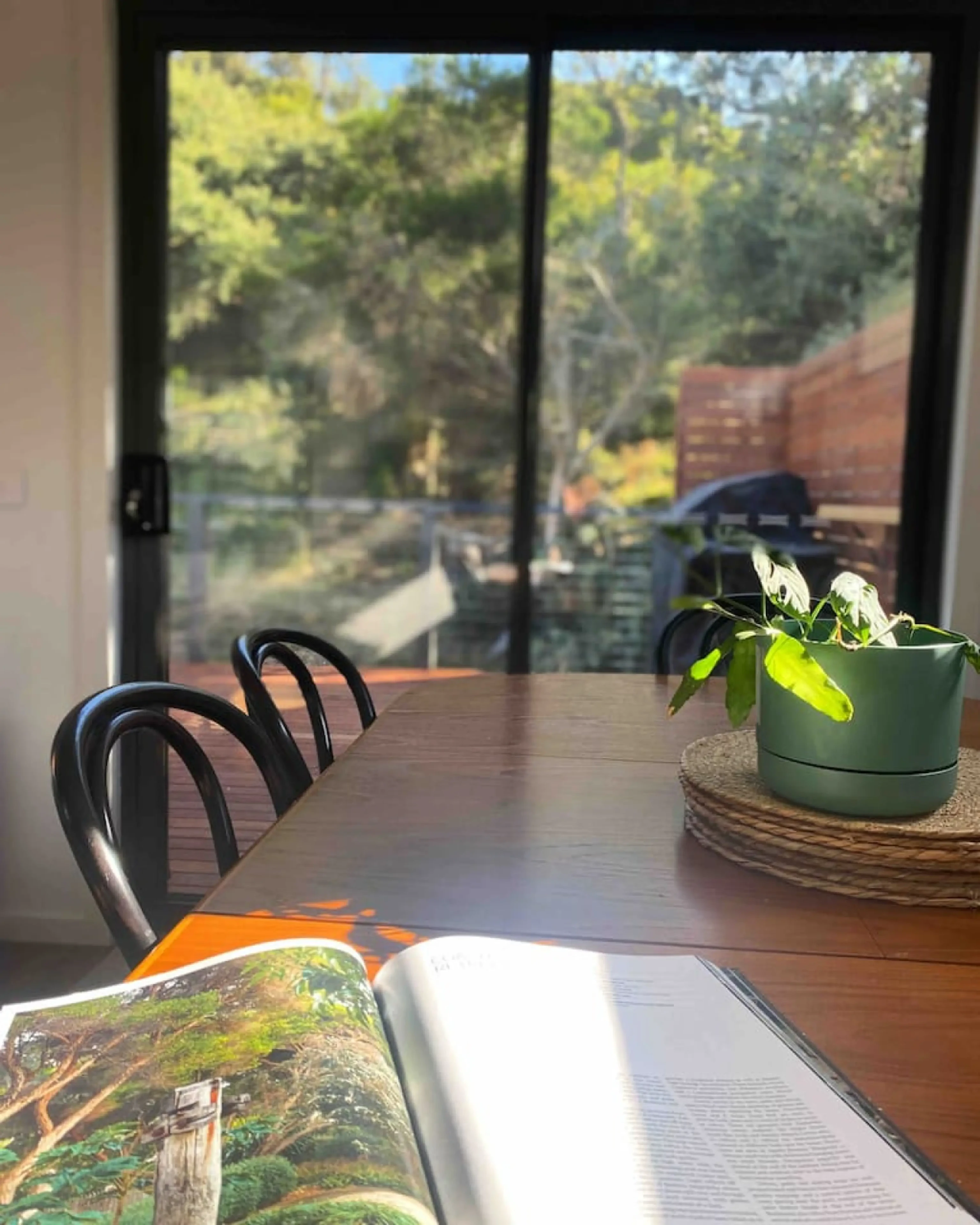 Dining table with garden view through sliding doors