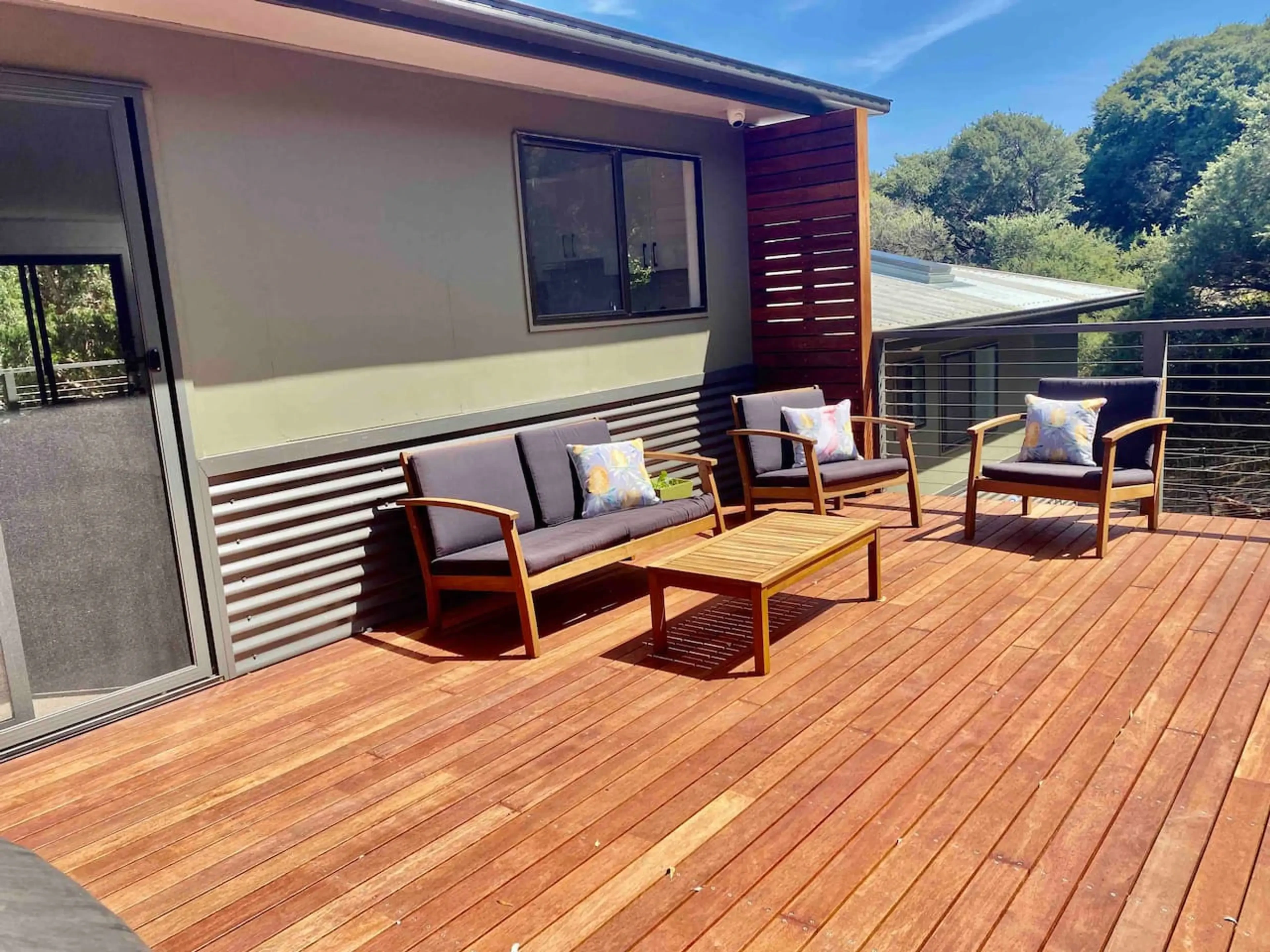 Spacious timber deck with outdoor lounge seating