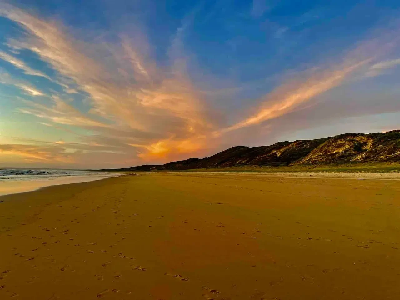 Venus Bay beach at golden sunset with dramatic clouds