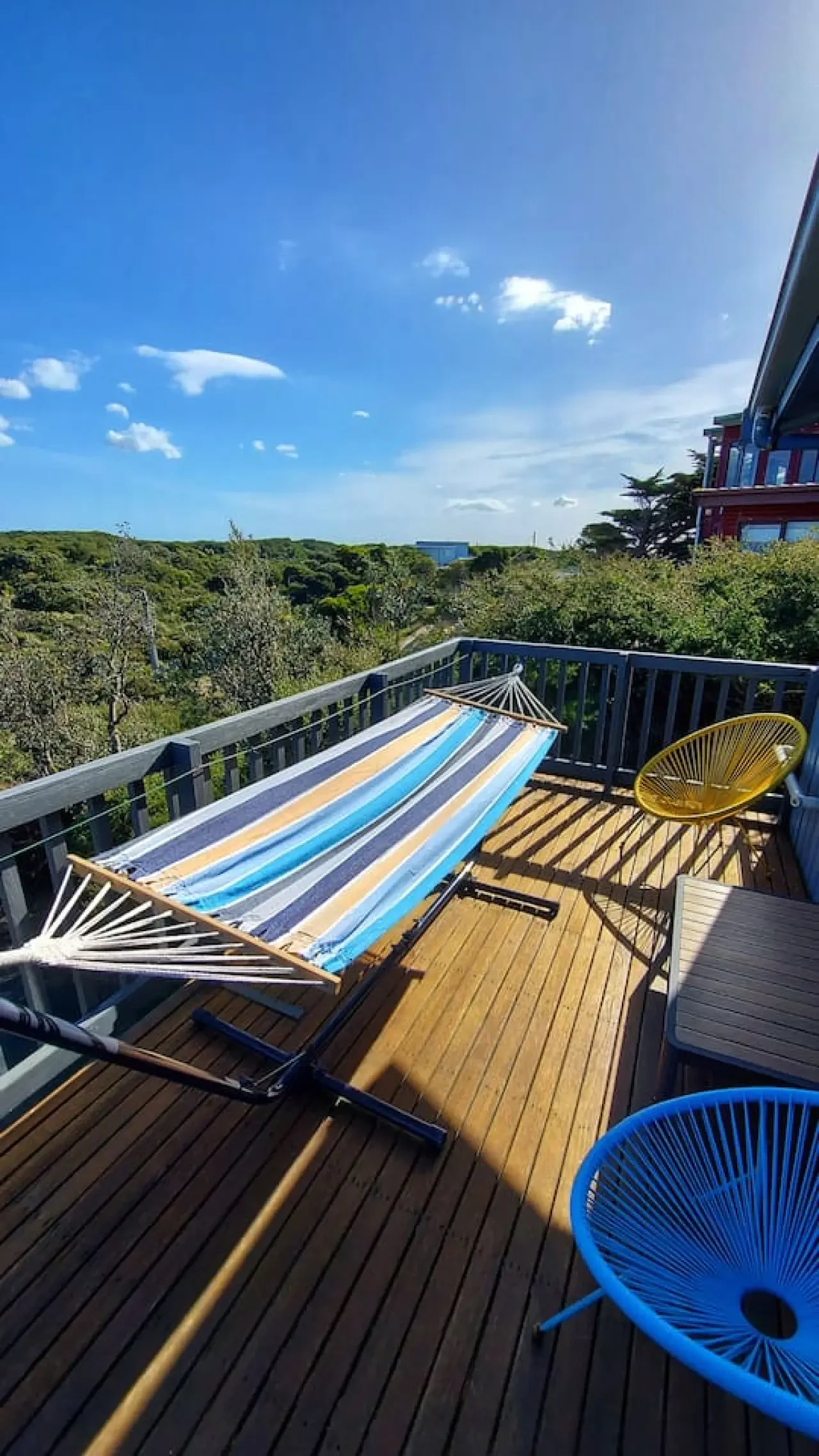Retro Dunes coastal deck with hammock and ocean view
