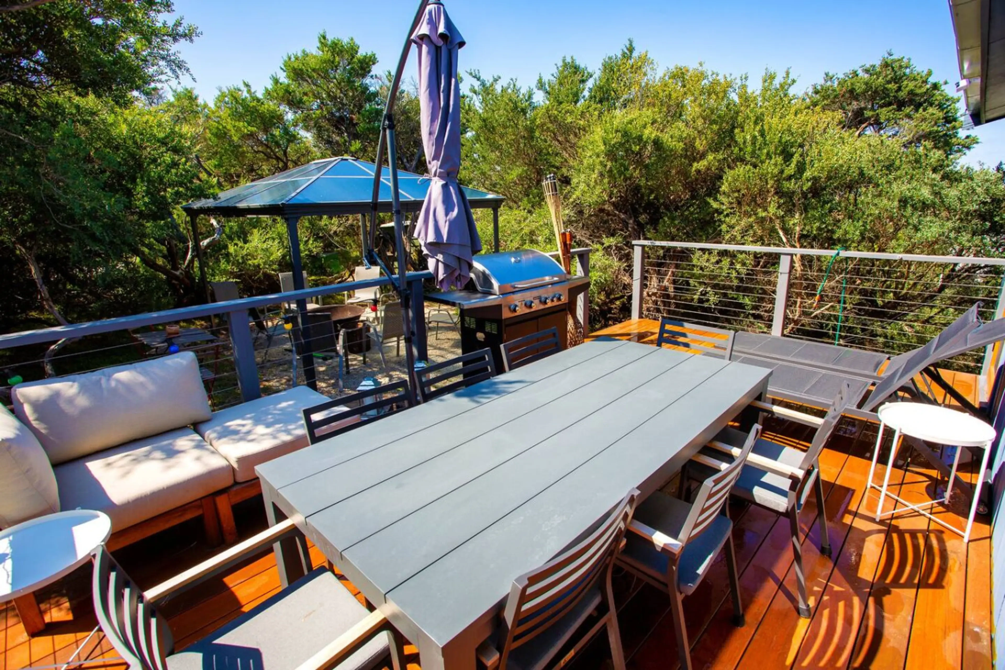Retro Dunes outdoor deck with dining and grill area